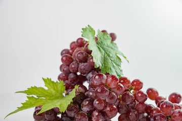 Ripe red grapes with leaves