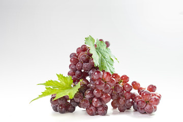 Ripe red grapes with leaves