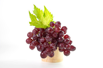Ripe red grapes with leaves