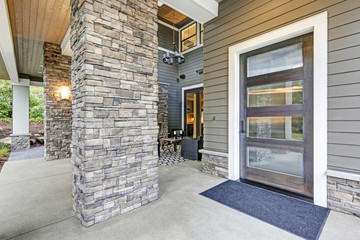 Covered porch accented with stone column