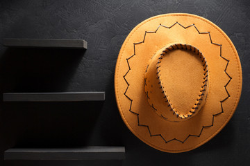 cowboy hat on wooden background.