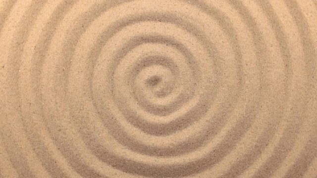 Beautiful lighting effects. Rotation sand in the form of a spiral.