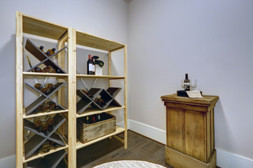 Wine room with wooden wine racks and wine tasting table.