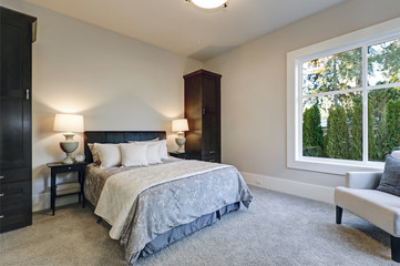 Cozy bedroom interior features soft creamy walls