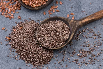 Fototapeten collection of grains in wooden spoon © oxxyzay