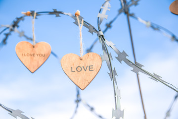 wooden hearts on the prison wall