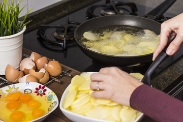 Cooker cooking a spanish omelette