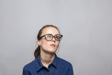 Portrait of bored woman in glasses