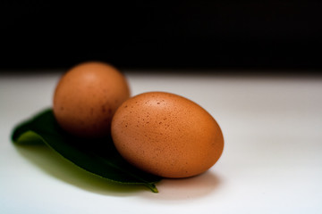 Chicken eggs on rustic black-and-white background