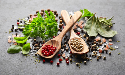 Spices and herbs on a black board
