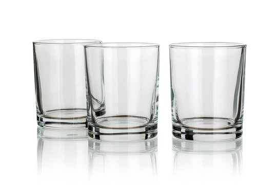 three whiskey glasses isolated