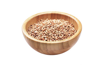 Buckwheat in bowl isolated on white background.