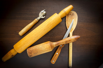 Wooden spoon and fork, knife on grunge wood background