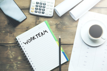 work team text on notebook