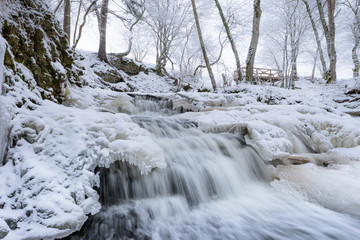 Fototapeta na wymiar Waterfall in winter