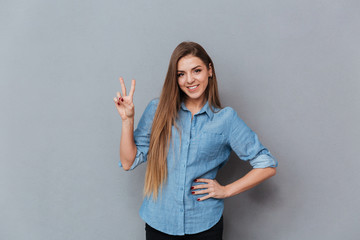 Woman in shirt showing peace sign