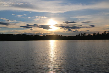 Fototapeta premium View of sunset on Tripp Lake Maine from a boat