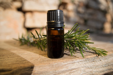 Rosemary oil in small glass bottle