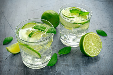 Detox water with green lime mint in glass cup