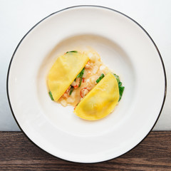 Ravioli-like dish with crayfish, apples and herbs