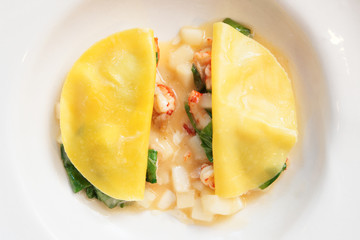 Ravioli-like dish with crayfish, apples and herbs
