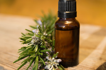 Rosemary oil in small glass bottle