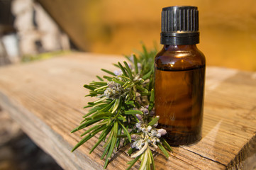 Rosemary oil in small glass bottle