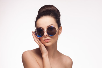 dark-haired woman in sunglasses