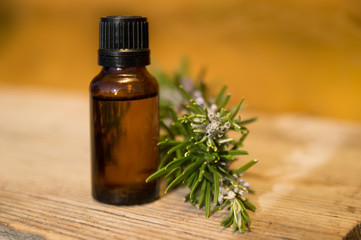 Rosemary oil in small glass bottle