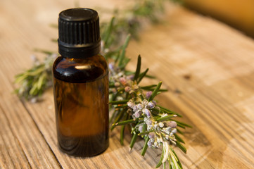 Rosemary oil in small glass bottle