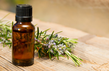 Rosemary oil in small glass bottle