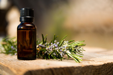 Rosemary oil in small glass bottle