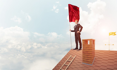 Young businessman with flag presenting concept of leadership. Mi