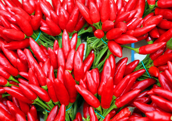 bouquets of red hot chillies at the greengrocer