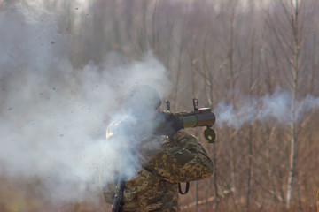 Military shooting from bazooka at warfield