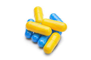 medicine yellow and blue pills on a isolated white background