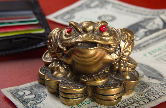 Money frog and two dollars.