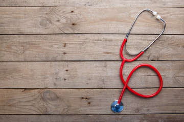 Workplace of a doctor - Stethoscope on the wooden desk