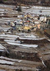 case e vigne nella neve a Segonzano; Val di Cembra, Trentino