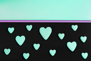 a pattern of tiffany hearts on a black background with copy-space
