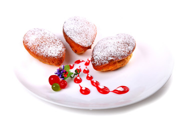 Three pirozhki covered with powder