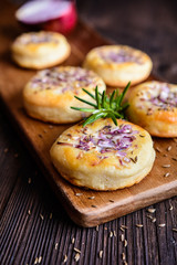 Salty pies with red onion and cumin