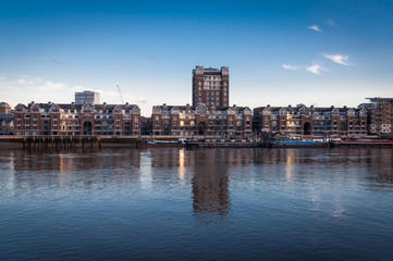 Fototapeta na wymiar Plantation Wharf, Chelsea riverfront on river Thames, London UK.