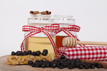 Honey in jar on a wooden background