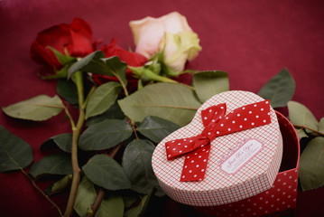 An opened gift and roses