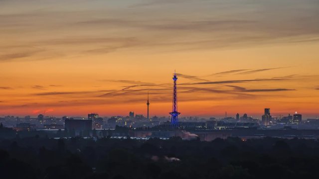 time lapse of Berlin Skyline and orange sky in the morning 