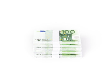 Stacks of 100 Euro Banknotes isolated on white background