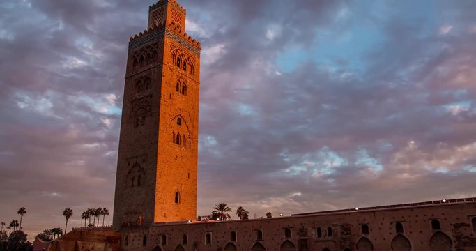 Timelapse Koutoubia Mosque in Marrakech at sunset on background of clouds, Morocco