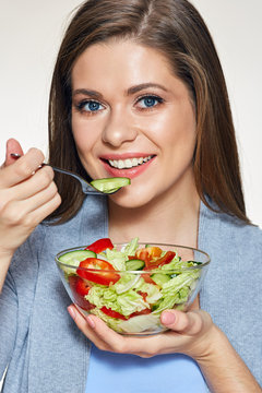 Woman eating salad. Isolated portrait