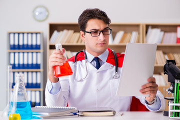 Superhero doctor working in the lab hospital